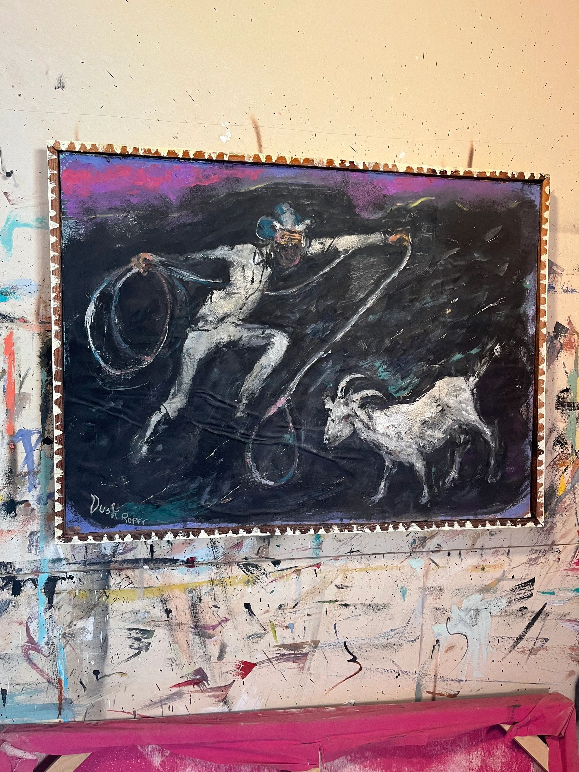 Painting of a cowboy roping a goat at dusk.