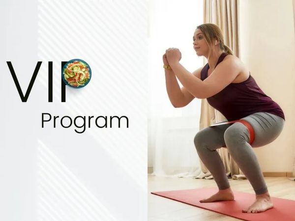 Woman exercising with resistance band in VIP program.