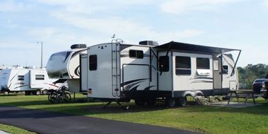 Interior RV grass site with a picnic table