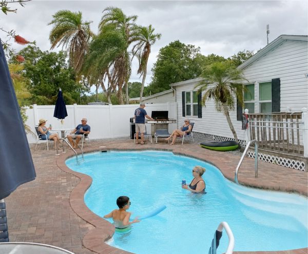 People enjoying a BBQ by the Sun Lake Pool
