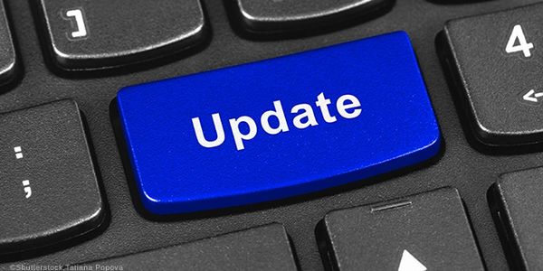 Blue 'Update' key on a black keyboard.