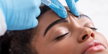 A woman receiving an injectable treatment.