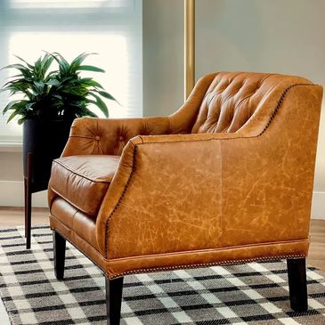 Resort-quality leather upholstery on a custom tufted armchair by M&M Renovations