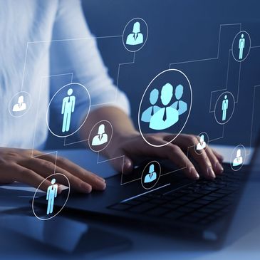 Image of person selecting a digital image of a three person icon over icons of individual people
