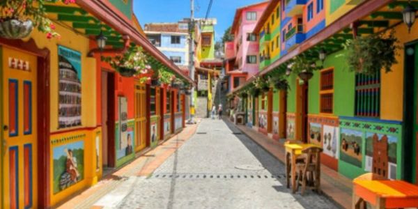 Colorful buildings lining a narrow cobblestone street.