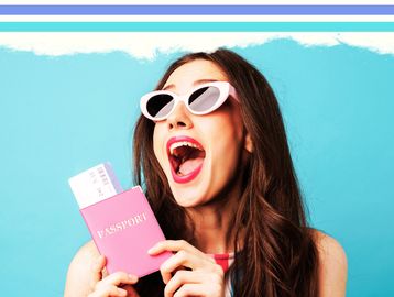 Excited woman with pink passport and tickets against a blue background.