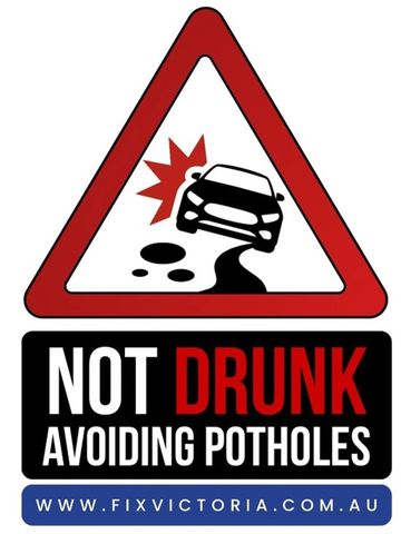 Bumper sticker - Not drunk, avoiding potholes.