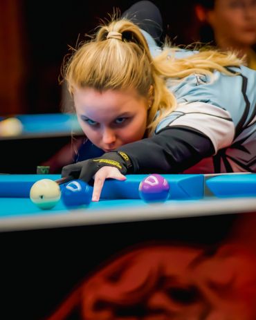 Kristina Tkach on the pool table in Atlantic City, New Jersey.  