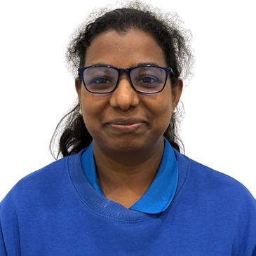 woman in a blue polo and wincheater