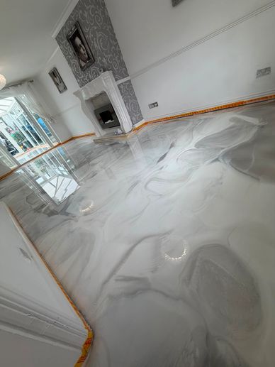 Glossy marble-like epoxy floor in a living room.