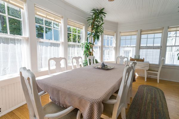 The sunroom boasts plenty of natural light, a great place to enjoy a cup of coffee