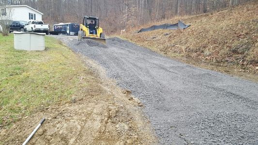An image of Barnett Excavating installing a new gravel driveway