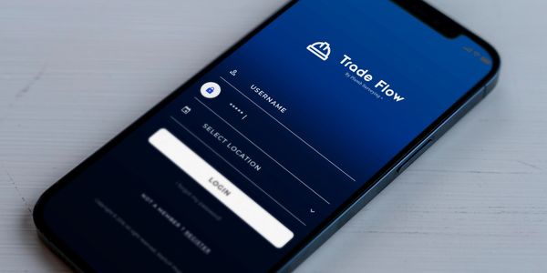 Smartphone displaying the login screen of the Trade Flow app with username and location fields.