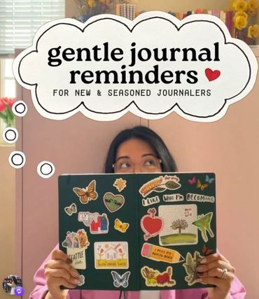 Person holding a sticker-covered journal with gentle journal reminders text.