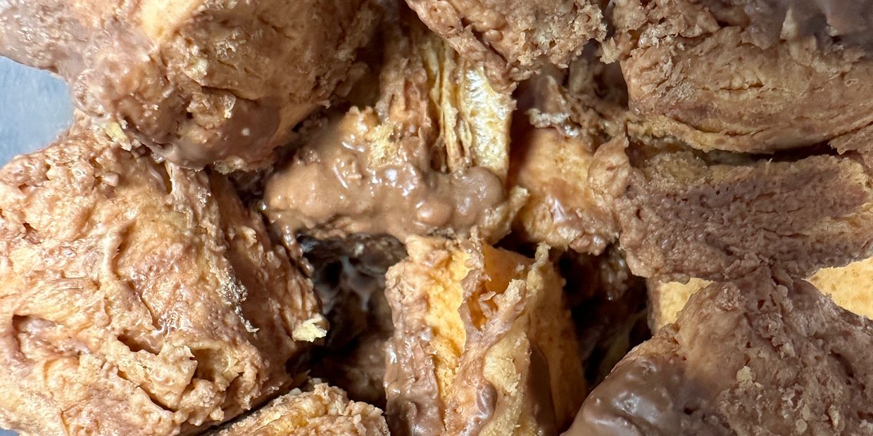Close-up of chocolate-coated wafer bites in a container.