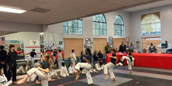 Children practicing martial arts in a dojo.