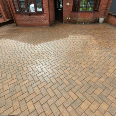 Cleaned block paving driveway looks new.