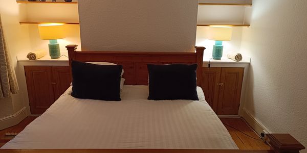 Karim Ahmed's holiday home master bedroom with king size bed and tasteful bedside lighting
