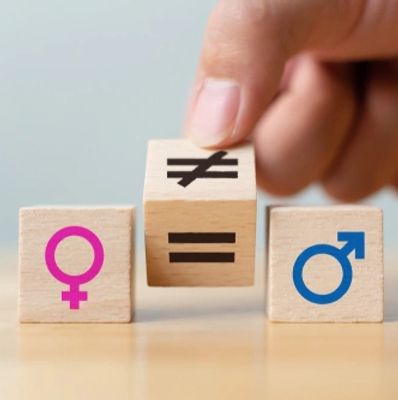 Concepts of gender equality. Hand flip wooden cube with symbol change unequal to equal sign
