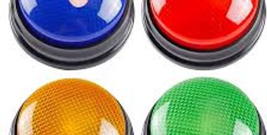 Four colorful plastic buzzers in blue, red, yellow, and green.