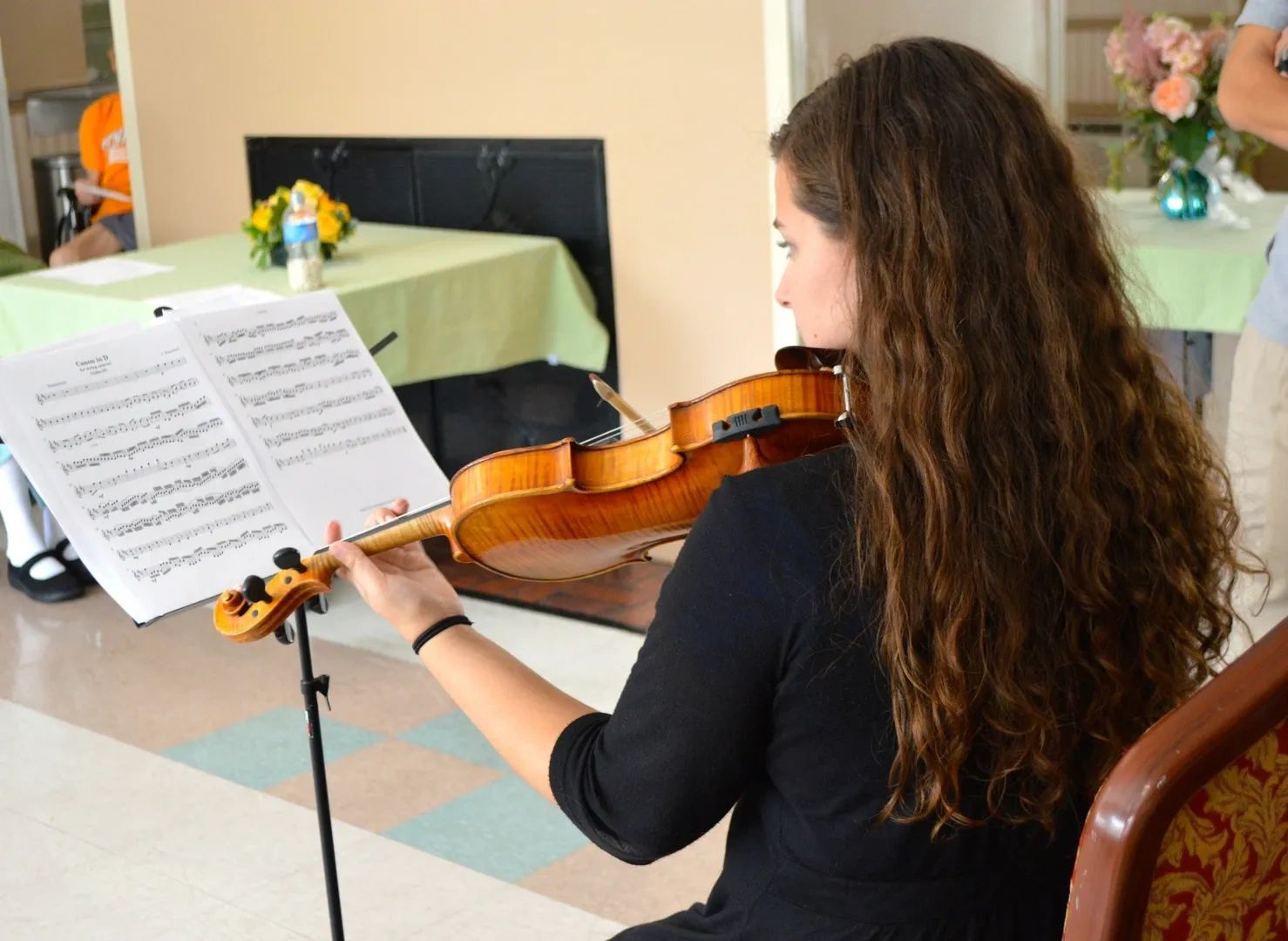 Violinist performing at a nursing home