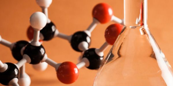 A model of a bunch of molecules with an orange background.