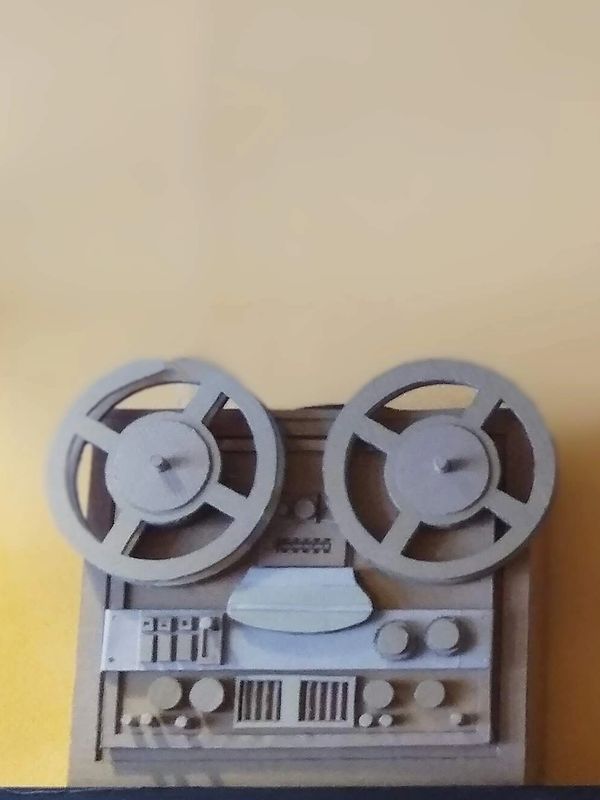 Art rendition of reel to reel tape recorder made of cardboard