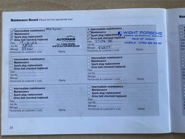 Car maintenance record showing services and stamps from authorized dealers.