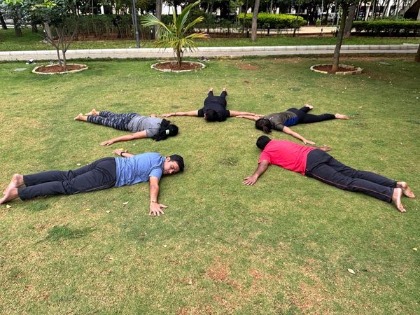 This outdoor session by Inner Axis Yoga Kulam emphasizes community, nature, and collective wellness.