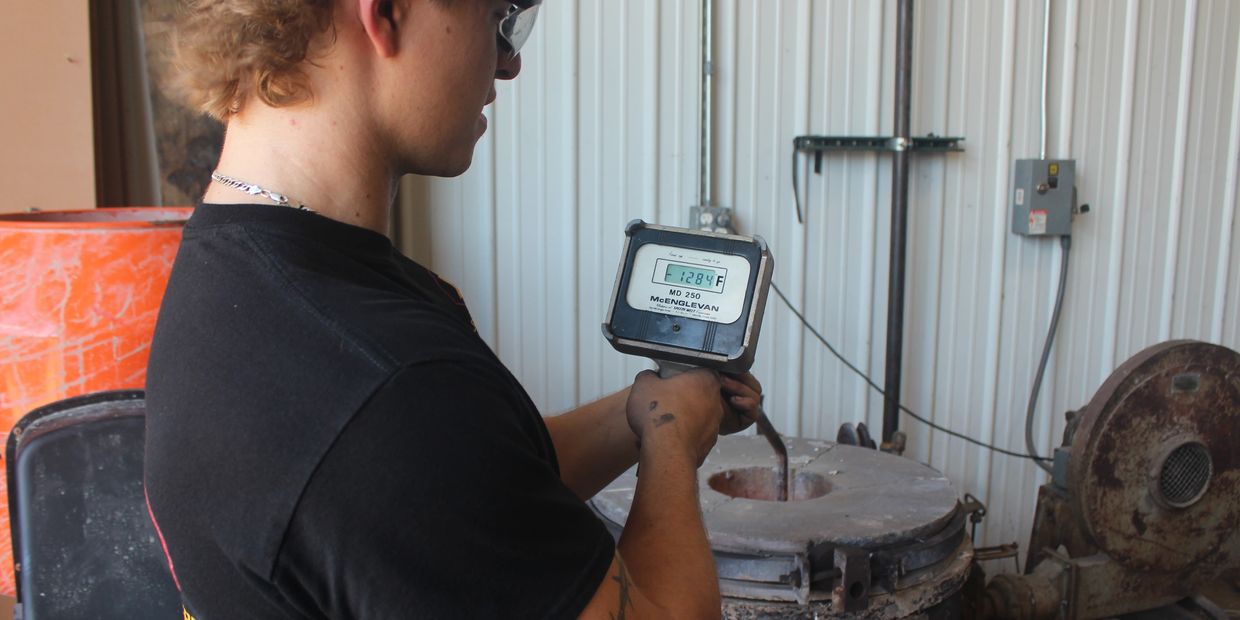 Person checking temperature with McEnglevan MD 250 device.