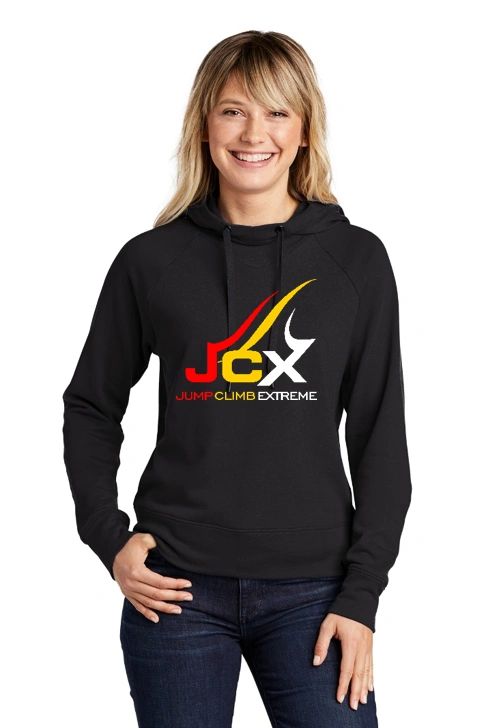 Woman wearing a black hoodie with a colorful JCX logo.