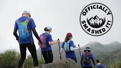 Officially smashed it hiking club logo with people hiking 