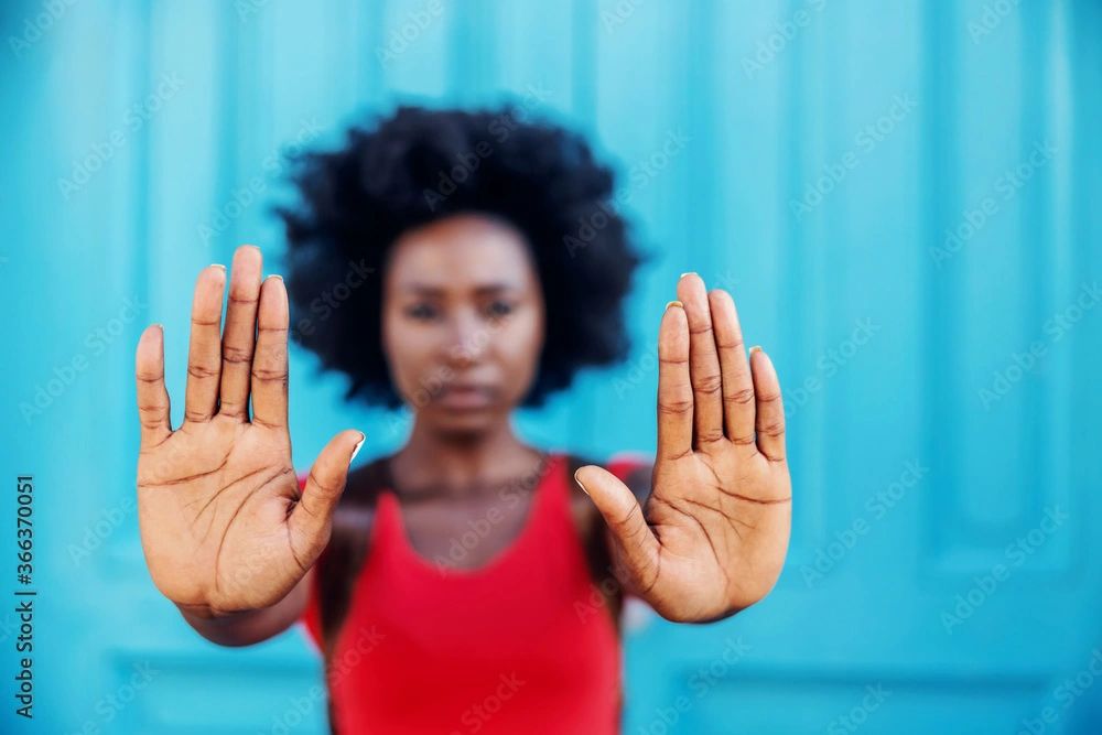 Picture of an African-American Woman with her hands held out.