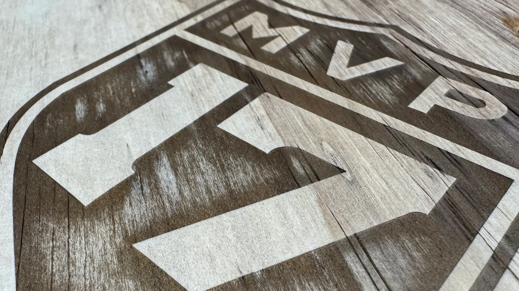 Close-up of a wooden sign with the number 17 and letters MVP.