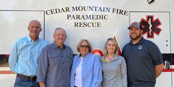 CMFPD Board Members standing in front of ambulance