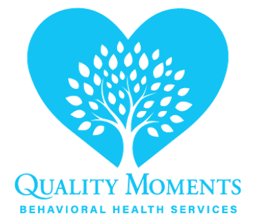 Logo of Quality Moments Behavioral Health Services with a heart and tree.