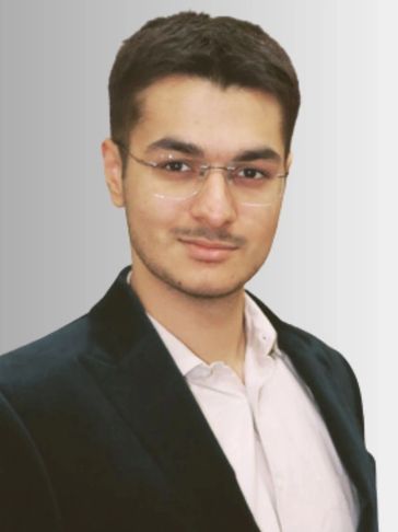 Portrait of a young man in glasses and formal attire.