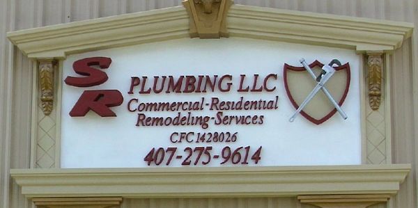 Sign for SR Plumbing LLC with contact info.