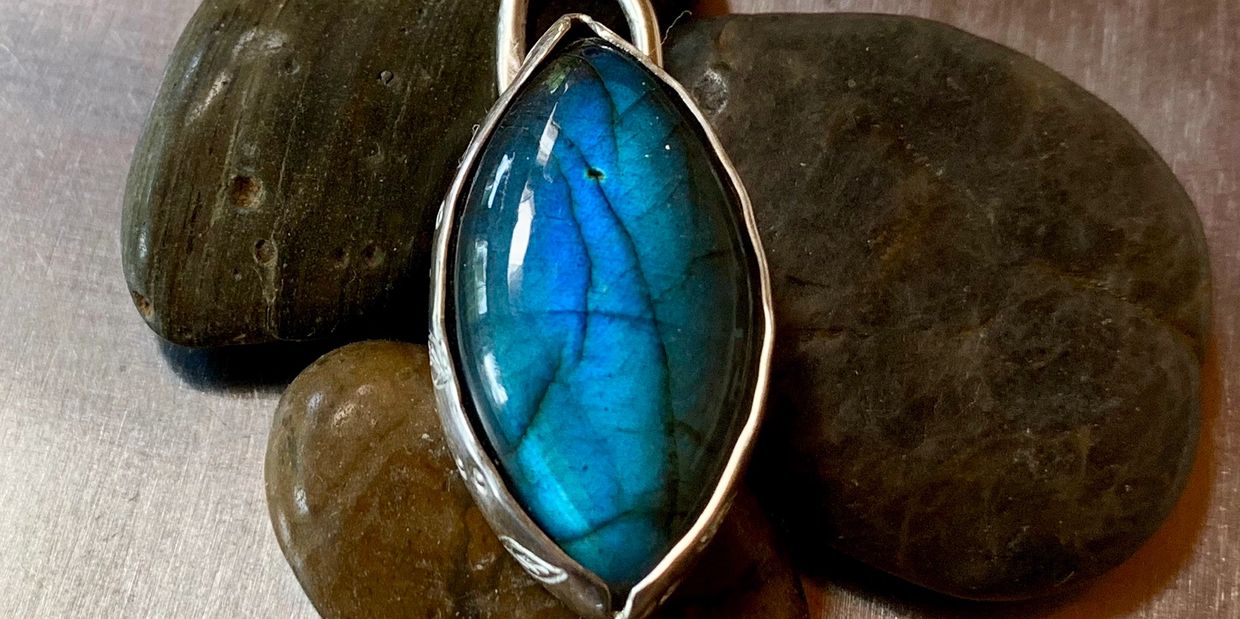 Gorgeous Labradorite cabochon set in a .999 silver pendant.