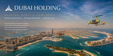 Dubai Holding aerial view with seaplane over coastal cityscape.