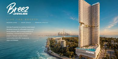 Breez Danube luxury towers overlooking the coastline with Dubai skyline.