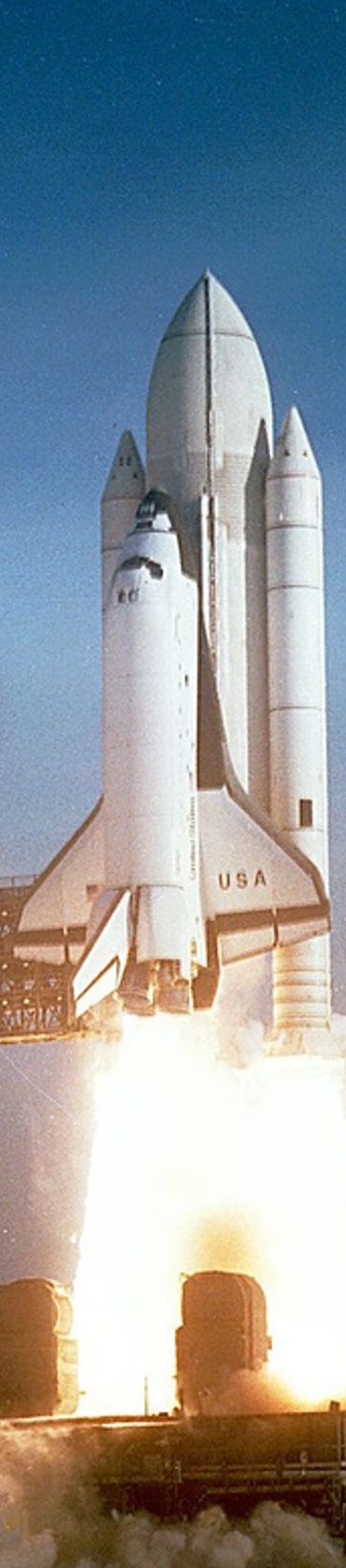 Space shuttle launching with powerful rocket flames and smoke.
