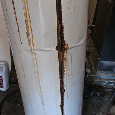 Local Emmett Idaho plumber installing a new water heater tank and disposing of 20 year old tank