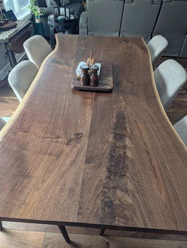 Recently completed and delivered this bookend walnut live edge dining room table for a client in Cha