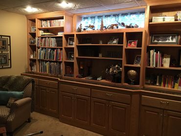 Oak built-in cabinets and bookshelf built to match existing woodwork. Soft close hardware.  