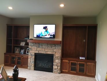Custom built in bookshelves above existing cabinets. Designed and built to match existing woodwork. 