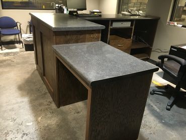 Oak front office desk with shelves. ADA accessible desk. Laminate countertop. Locking cash drawer