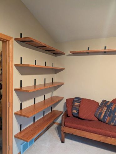 A very clean and elegant solid oak shelving project built to display a pottery collection.