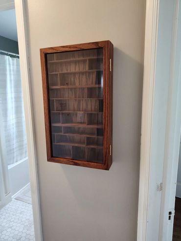 Custom oak rock/shell display case with glass door. Magnetic door latch.