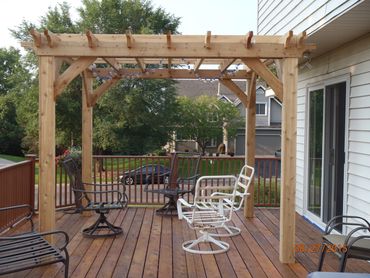 Custom designed, manufactured and installed cedar pergola. Made of 6" x 6" posts and 2" x 8" roof cr